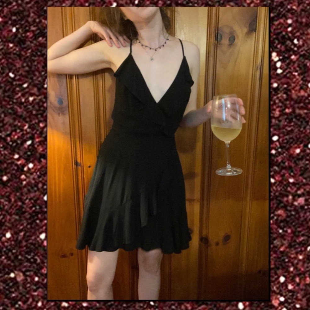 Lil black dress with lace up back & ruffle skirt